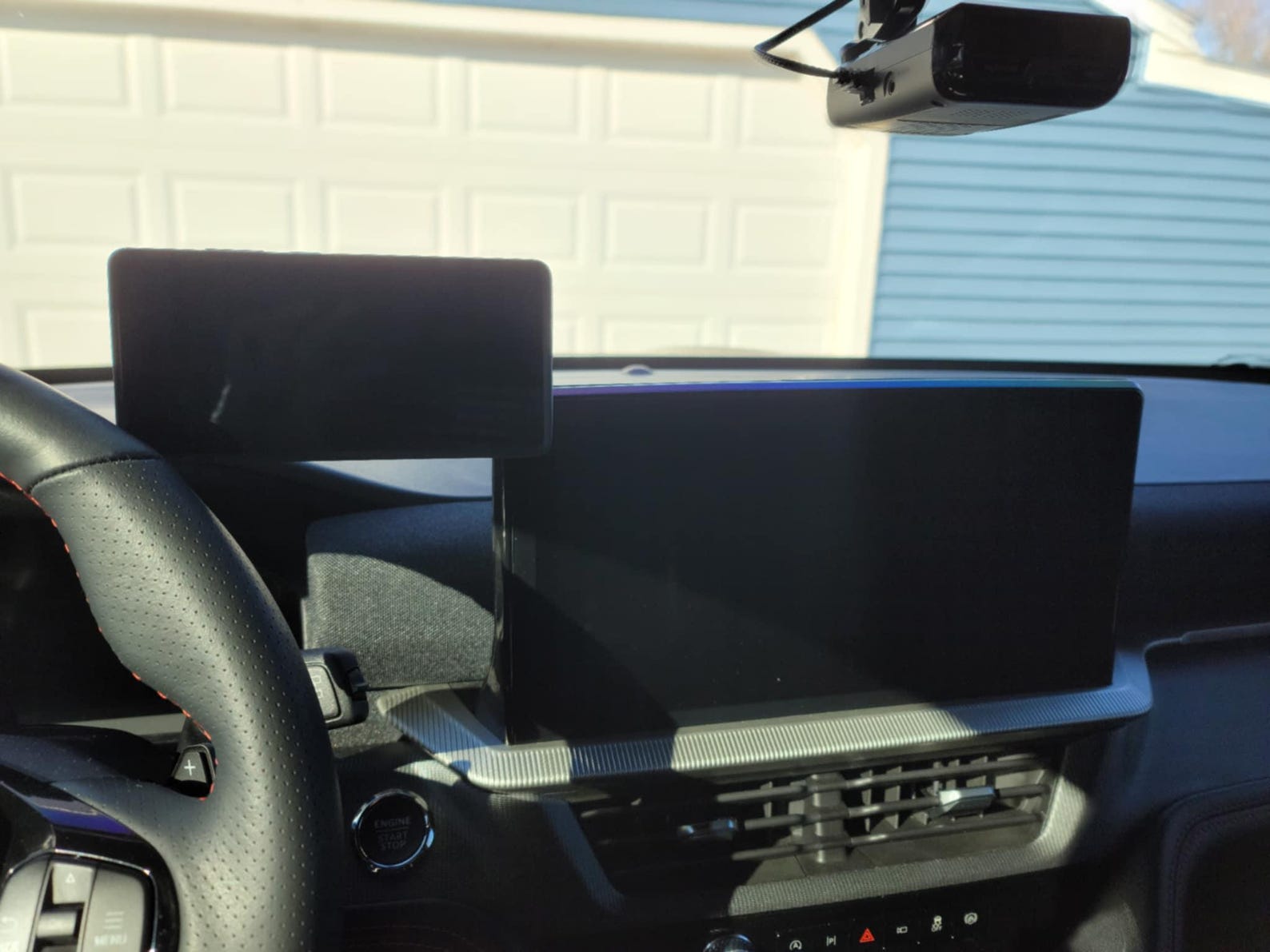 Actual GSP phone mount installed beside a Ford Explorer screen